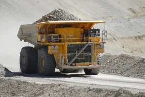 Mining dump truck transporting materials in a quarry, illustrating mining operations relevant to Brisbane's training opportunities.